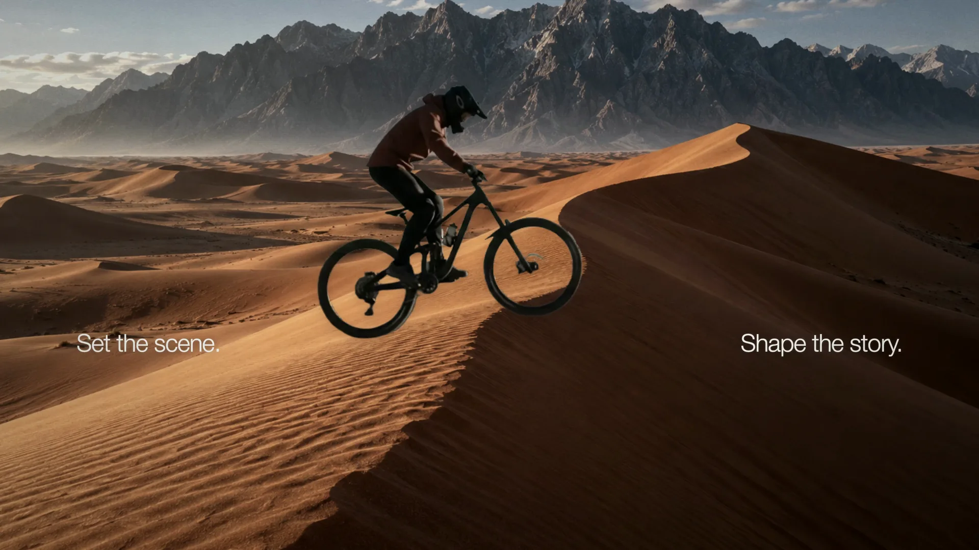 A mountain biker riding a desert dune between the words Set the scene and Shape the story
